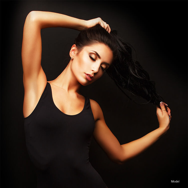Woman running hands through hair