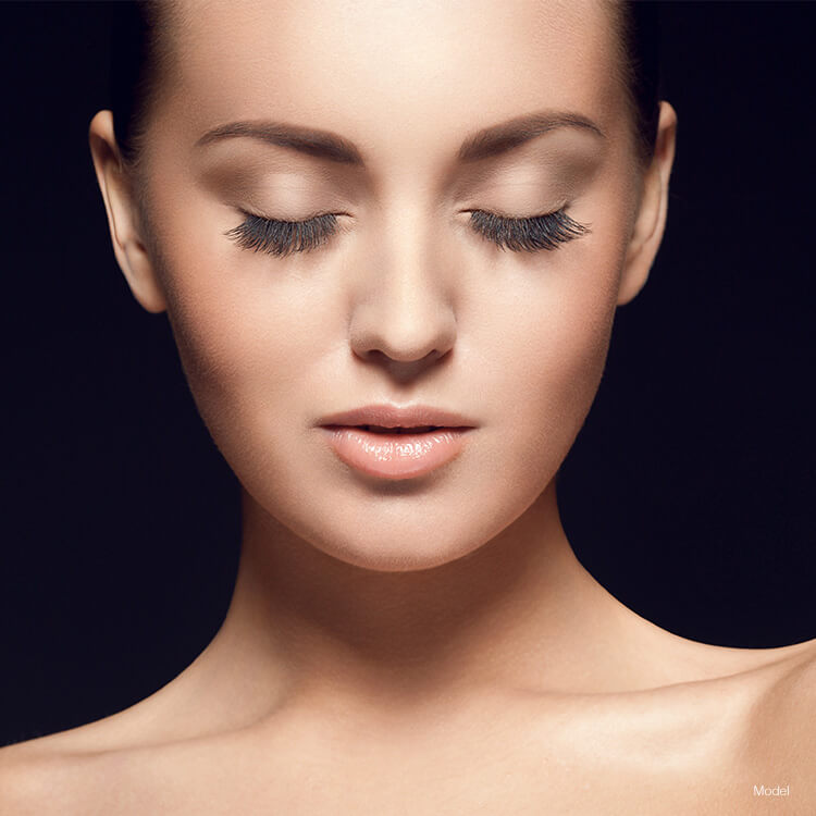 woman with eyes closed