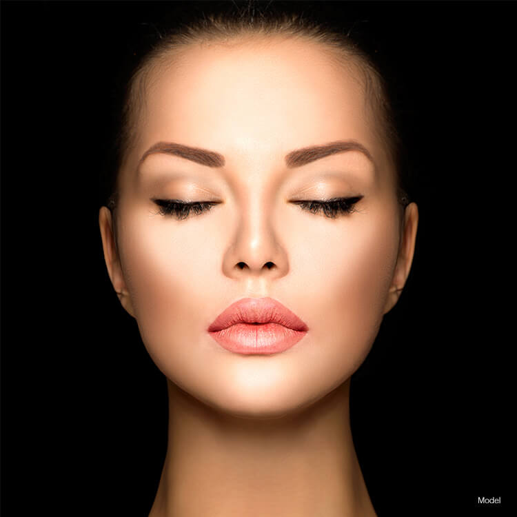 Up close of woman's face with eyes closed