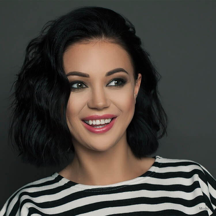 Beautiful smiling woman in striped shirt