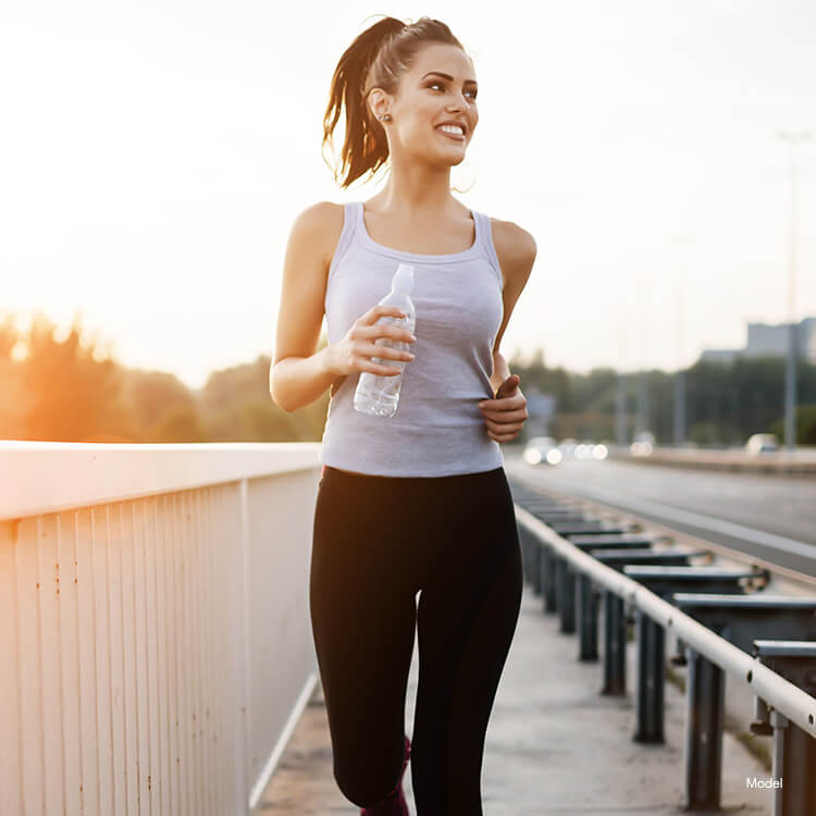 Woman running after a Meyer’s Cocktail treatment
