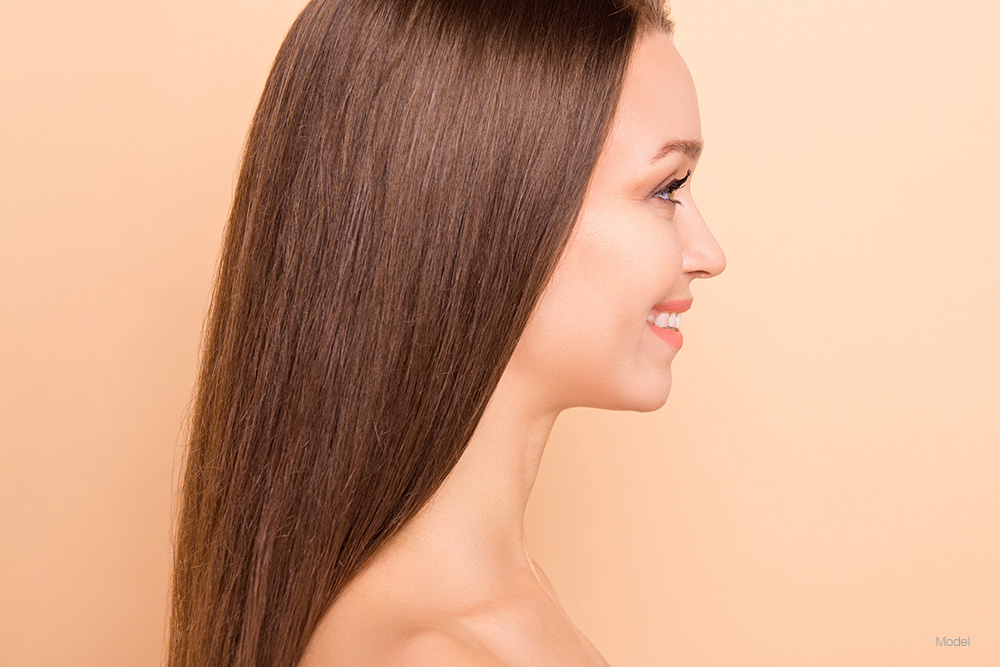 Profile of a young woman with brown hair